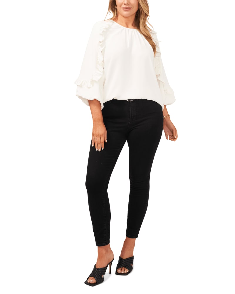 Front of a model wearing a size 1X Leah Ruffle Blouse in NEW IVORY by Vince Camuto. | dia_product_style_image_id:261620